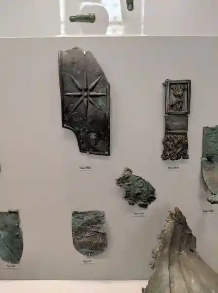 Bronze armor pieces from ancient statues